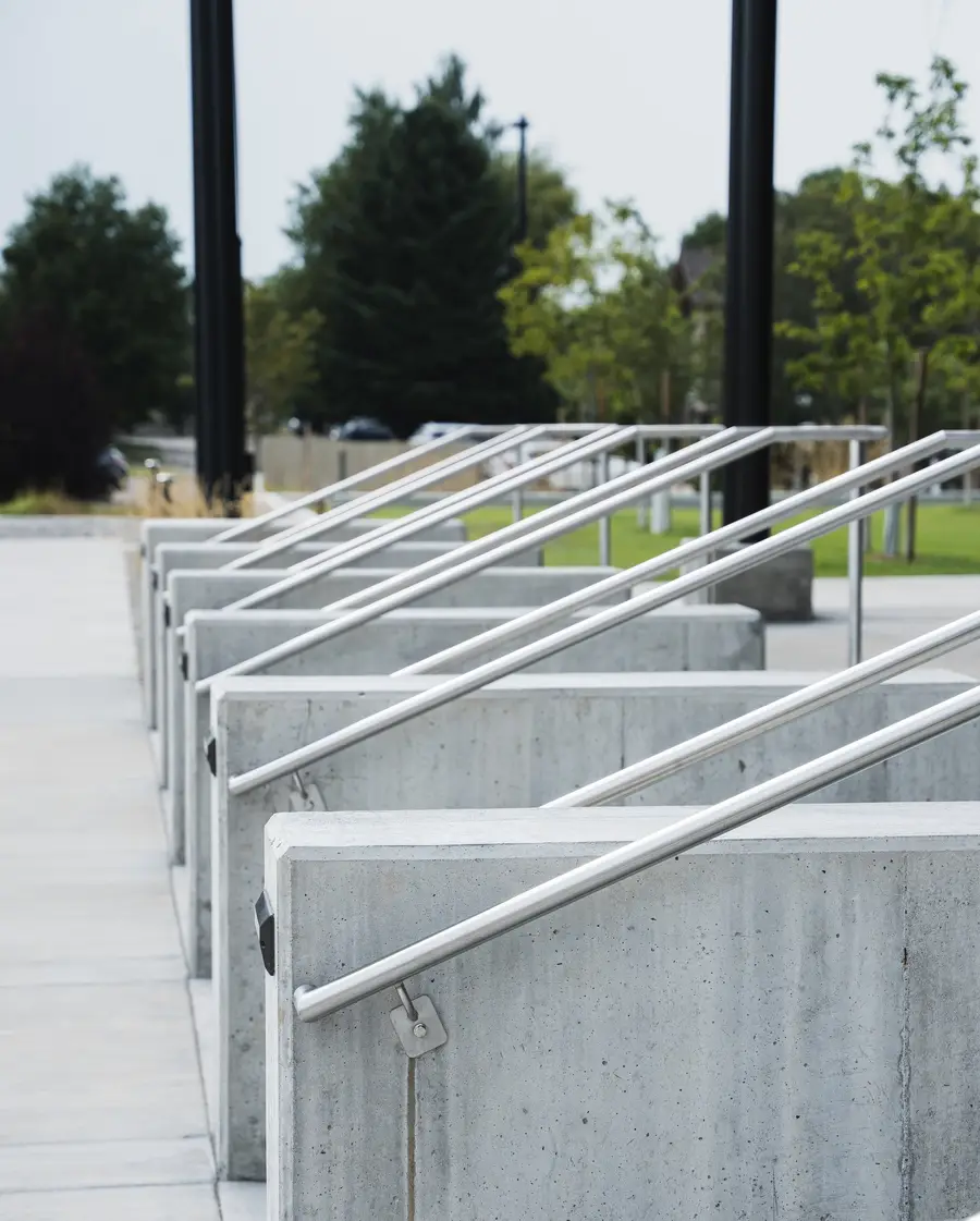 A run of stainless steel handrails on the concrete entry steps of the Gallatin County Justice Center