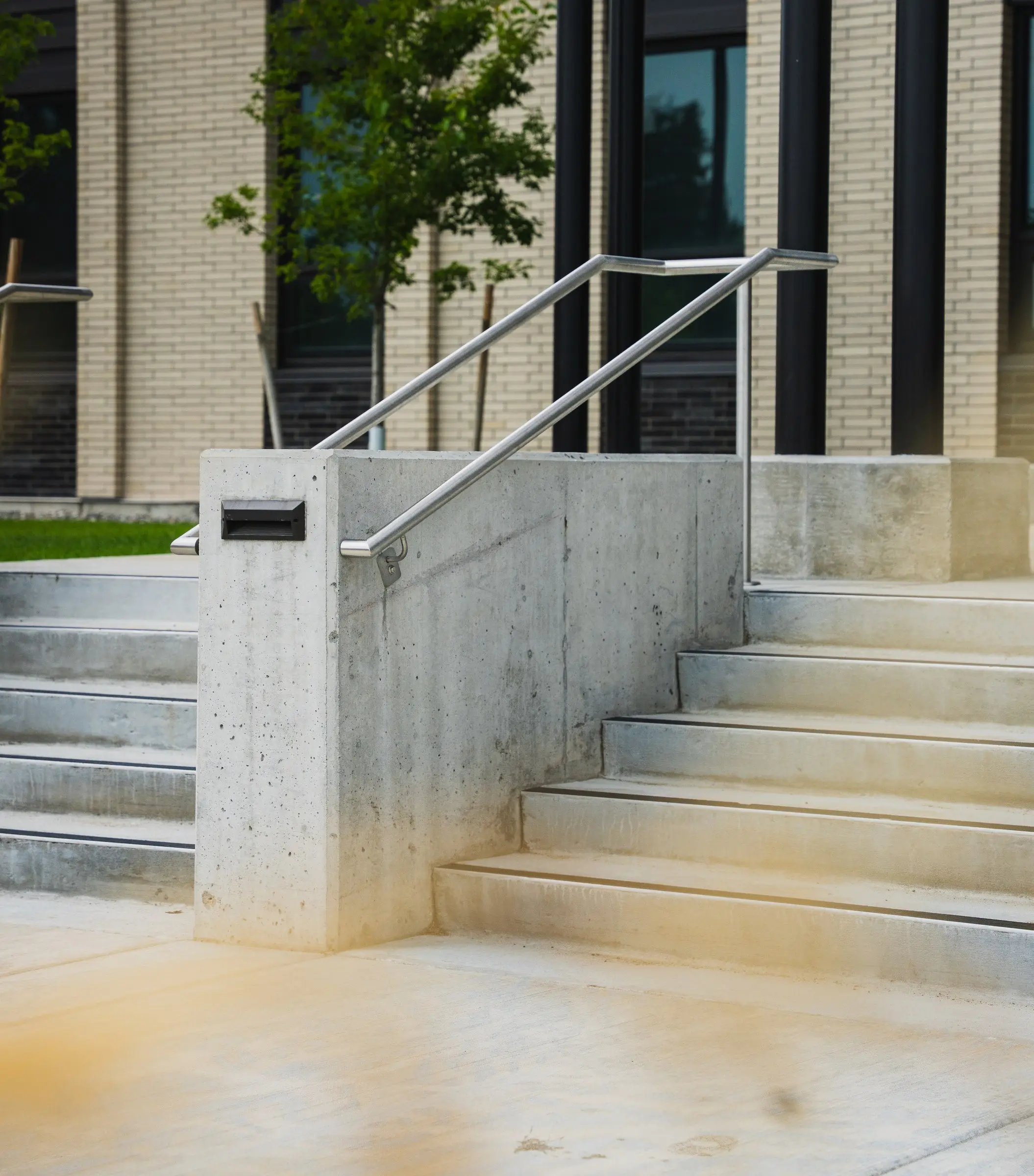 Stainless steel handrails on a concrete entry stair at the Gallatin County Justice Center